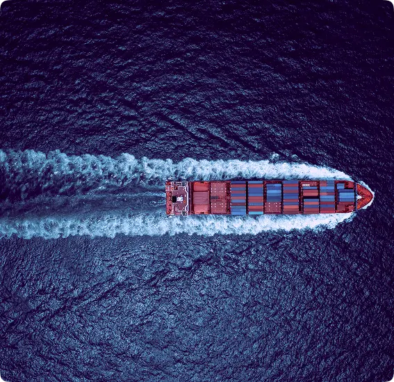 Aerial view of cargo ship sailing in ocean